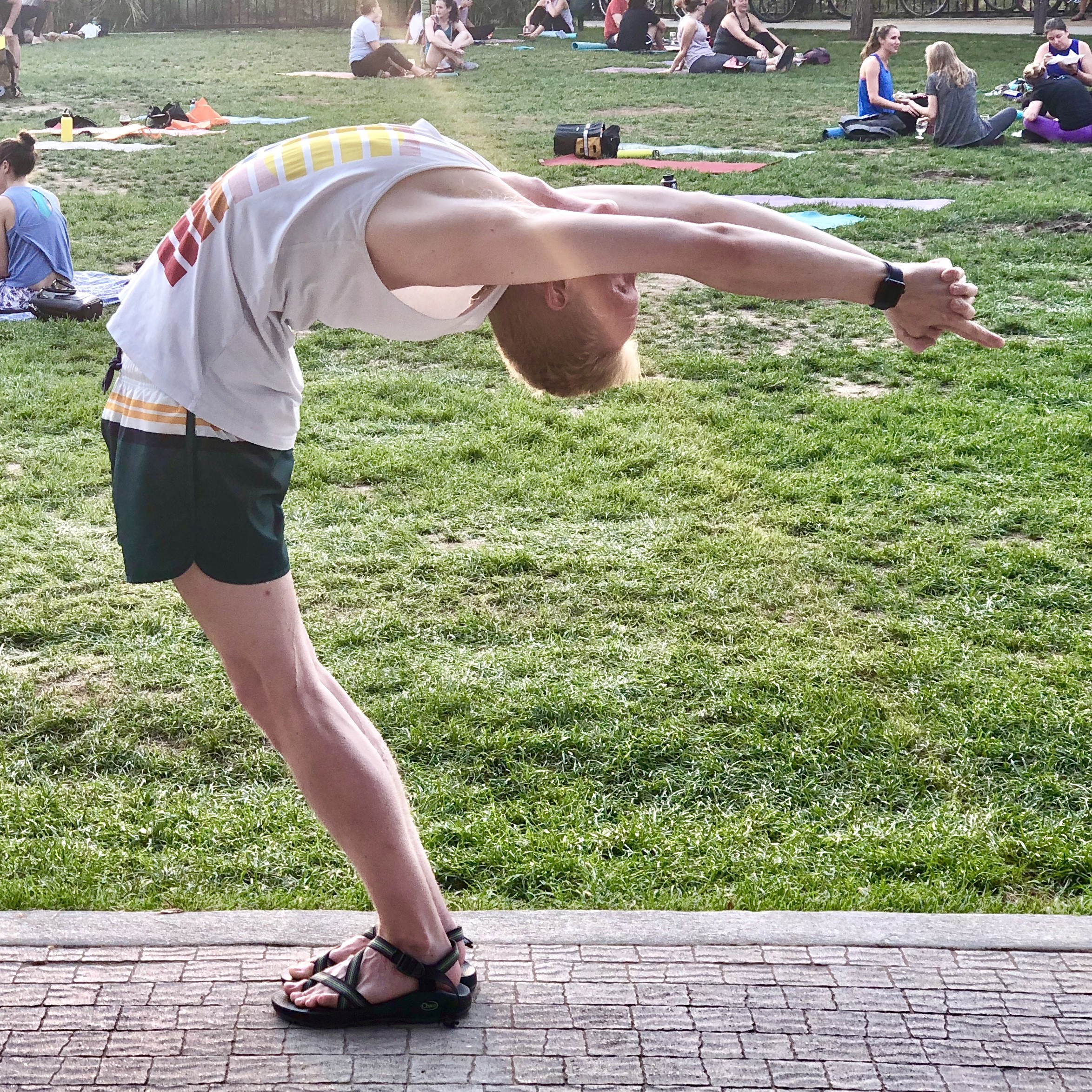 Joshua practicing yoga outdoors